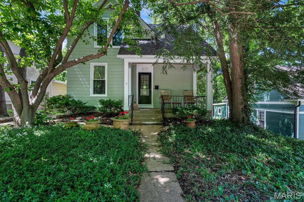 Charming Webster Groves character, modern updates, and a backyard you'll love. Situated on a deep, nearly quarter-acre lot, this 2-bedroom, 1.5-bath home welcomes you with a covered front porch, high ceilings, beautiful natural light, and timeless architectural details. The spacious dining room features a wood-burning stove, while the updated kitchen offers granite countertops, custom cabinetry, stainless steel appliances, and a gas range. Upstairs, you'll find two generously sized bedrooms and an updated Jack-and-Jill bath with custom tile and a classic clawfoot tub. Recent updates include windows throughout the home. Outside, enjoy the large deck overlooking the fenced, tree-lined backyard—perfect for relaxing, entertaining, or enjoying your own private retreat. Conveniently located near parks, restaurants, shopping, and all that Webster Groves has to offer.