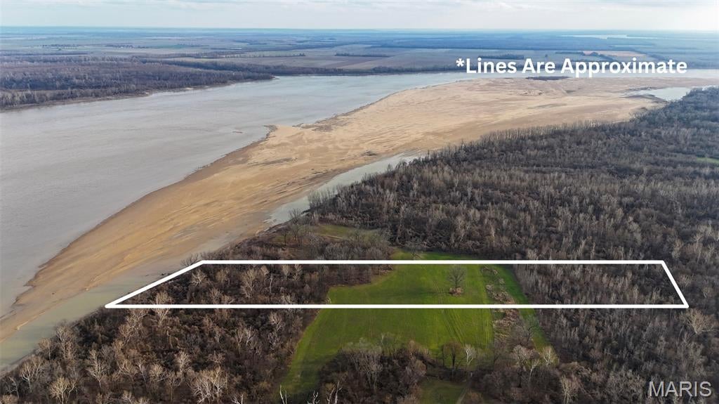 Positioned along the banks of the Mississippi River and surrounded by Missouri Conservation Department land, this 13-acre tract offers exceptional hunting and recreational potential. With a healthy percentage of open ground, the property is ideally suited for food plots to draw deer and turkeys from the adjacent timbered public land. Direct river access opens up endless opportunities for waterfowl hunting, fishing, and boating. An additional bordering tract to the south is also available for purchase. Property is to be sold as-is.