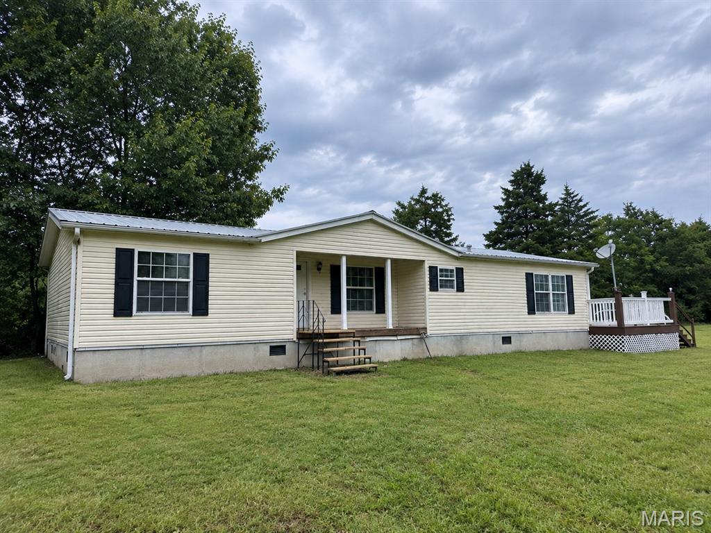 Welcome to 139 Wisteria Lane in Troy! Situated on 3 acres with minimal restrictions, this 3-bedroom, 2-bath manufactured home offers country living with added income potential. The home features a spacious primary suite, comfortable living areas, a nice deck for relaxing or entertaining, a durable metal roof, and a newly drilled well.

A unique bonus is the second mobile home pad with a separate meter already in place, offering potential for an additional rental or other use. Property cannot be subdivided. Whether you're looking for a place to call home, an investment opportunity, or a property with room and flexibility, this one is worth a look!