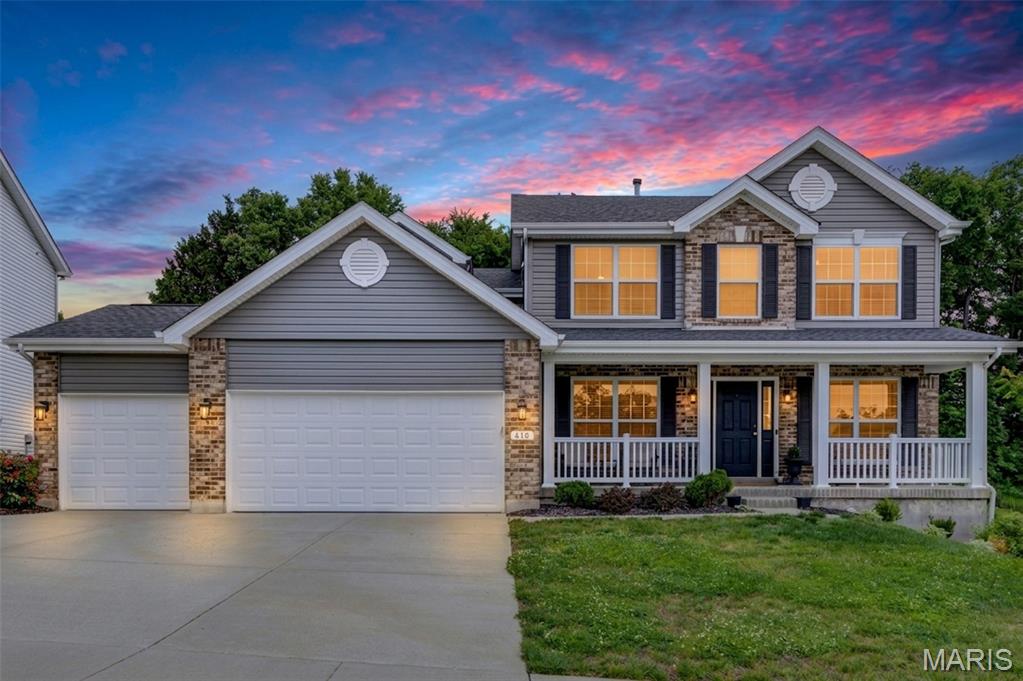 There’s something about this home that just feels good the moment you walk in. Maybe it’s the way natural light fills the space from morning to evening, or how every room feels calm, open, and connected. The kitchen is the heart of the home with 42" white shaker cabinetry, quartz countertops, stainless appliances, smart fridge, double ovens, walk-in pantry, and a large beautiful quartz island where mornings start slowly and everyone naturally gathers at the end of the day. Oversized windows across the back of the home bring the outside in and give the entire main floor a bright, airy feel. Wide plank flooring flows seamlessly throughout the main level creating an open, connected feel throughout the home. In addition to the separate formal dining room, the front sitting area offers flexibility for a home office, reading space, play room, or additional living area. Main floor laundry is located just off the main living area. Upstairs, the spacious primary suite offers the perfect place to unwind with double vanities, soaking tub, separate shower, and walk-in closet, while three additional bedrooms provide flexibility for guests, office space, or whatever comes next. Located in Lake St. Louis, this beautiful home is just 6 years old and offers a fenced backyard, 3-car garage, and access to neighborhood walking trails, all in a setting that feels peaceful while still keeping you close to everything. Every space in this home feels intentional, inviting, and ready to be lived in from day one.
