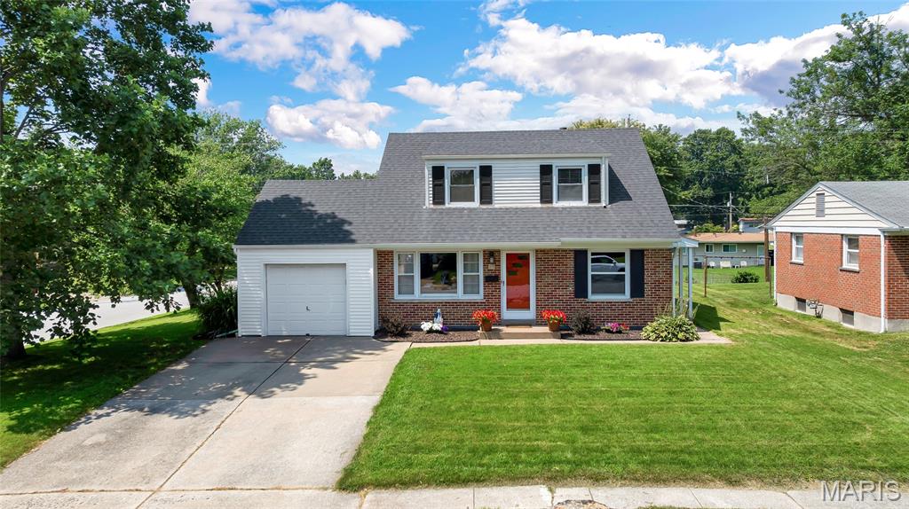 Welcome to this charming, updated split level home offering 4 bedrooms, 2 full baths, and a smart, zoned layout that lives much larger than it looks.  You step directly into the heart of the home, where the living room, dining area, and kitchen open to one another on a bright, connected main level. The kitchen is built for cooking, with upgraded cabinetry, Silestone countertops, a tiled backsplash, and a center island.  A few steps down you will find a second living space along with a full bath and the laundry room. It is the kind of flexible room that works as a family room, media room, playroom, or home office.  Head up a short flight from the main level to two bedrooms and an updated full bath, then continue up to two more bedrooms tucked privately at the top of the home. The staggered levels give everyone a little breathing room. Best of all, there is no carpet anywhere. Every room is hardwood or ceramic tile.  Outside, enjoy a low maintenance brick and vinyl exterior on a level corner lot with mature trees and freshly landscaped planting beds. Convenient to I-70 and Highway 370, you are minutes from shopping, dining, parks, and the shops, restaurants, and riverfront charm of Historic Main Street in Old Town St. Charles.