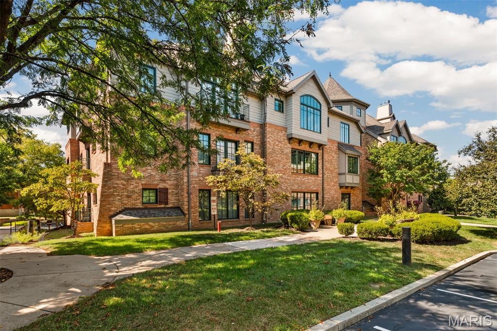 Welcome to 127 E Clinton Pl located in The Terraces of Kirkwood, where spacious, low-maintenance living meets an exceptional location in the heart of Kirkwood. This top-floor 3-bed, 2.5-bath condo offers an impressive 2,274 SF, treetop views, with ease of elevator access—all just moments from some of Kirkwood’s favorite dining, shopping, and entertainment.
Inside Condo 3B, a limestone floor entry creates a polished first impression, while an oversized storage closet provides a surprisingly generous place for everything you want tucked neatly away. A conveniently located powder room nearby is ideal for guests and entertaining.
The light-filled family and dining rooms feature wood floors and vaulted ceilings unique to the top-floor setting, creating an open, airy feel with beautiful views into the surrounding trees.
The kitchen offers granite countertops, a gas range with vent hood, a breakfast bar opening to the family/dining area, double sink, built-in dining bench, writing desk/coffee bar, separate pantry, microwave and included refrigerator. Just off the kitchen, a dedicated laundry room provides cabinetry and a utility sink.
The spacious primary suite features a walk-in closet with brand-new carpet and a private bath with dual vanities, jetted tub, separate shower and linen closet. The second bedroom also has brand-new carpet, with a hall bath just across the way featuring a marble countertop. The third bedroom/den provides wonderful flexibility with custom built-ins.

A private, gated underground garage adds another level of convenience, with TWO assigned parking spaces ideally positioned right near the elevator and private garage storage nearby. Ample guest parking makes entertaining easy, too. The building has also benefited from significant recent improvements, including a new roof in 2024 and new windows in 2025.
And then there’s the location! Enjoy the best of Kirkwood just outside your door, with Spencer’s, First Watch, Kaldi's, Stages St. Louis, Kirkwood Performing Arts Center, post office, and an abundance of restaurants, shops and everyday conveniences.
Generous square footage, top-floor views, elevator access, ample parking and storage, and a highly desirable Kirkwood location come together in a condo that offers space, convenience and an easy lifestyle with the comforts of home.