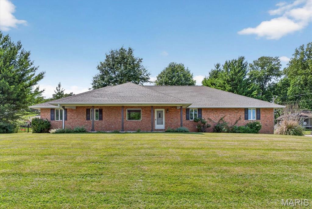 Location, space, and opportunity, this Greenfield Manor home has it all! Homes in this highly desirable neighborhood rarely come on the market, making this your chance to own a well-maintained full brick ranch in one of Waterloo's most sought-after locations. Enjoy being just minutes from Waterloo schools, downtown shopping and dining, and Konarcik Park.

Offering 2,220 square feet all on the main level, this home features a spacious and functional floor plan. Step inside to a large living room that flows into the kitchen, where you'll find an abundance of cabinet and counter space, along with a breakfast bar. A separate dining room provides additional space for dinners.

The main floor also includes a generously sized laundry room, two secondary bedrooms connected by a Jack and Jill bathroom, and a spacious primary suite complete with a walk-in closet and private bathroom.

The unfinished basement offers endless possibilities for future living space, storage, or hobbies, allowing you to customize it to fit your needs.

Step outside to enjoy the covered back patio overlooking the fenced backyard, offering the perfect place to relax or entertain. Additional features include a side-entry 2 car garage, full brick exterior, and an unbeatable Waterloo location.

Don't miss your opportunity to own this spacious ranch in Greenfield Manor. Schedule your private showing today!