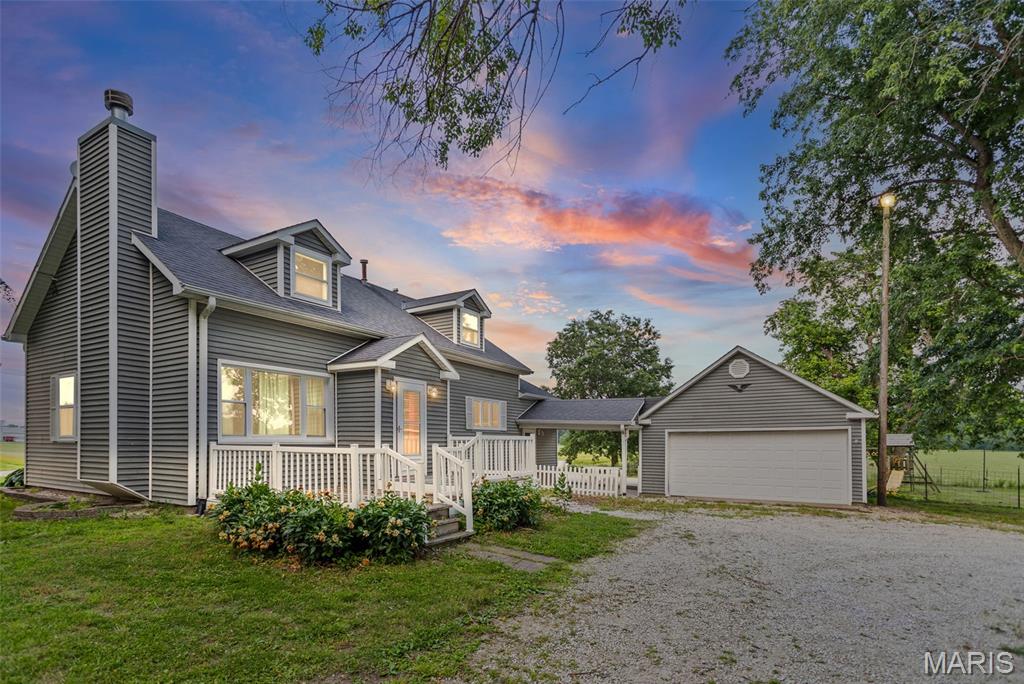 Country charm meets modern updates in this beautifully renovated farmhouse located in rural Barry, Illinois! Situated on approximately 0.87 acres and surrounded by picturesque Pike County farmland, this two-bedroom, two-bath home offers the peaceful country setting you've been searching for. The main level features a comfortable bedroom, full bath, cozy living room with a wood-burning fireplace, beautiful original hardwood doors, and built-in cabinetry that showcase the home's timeless character. The kitchen flows into a spacious family room that could also serve as a formal dining area. A charming nook at the base of the staircase provides the perfect space for a home office, reading corner, or breakfast area. Upstairs, the open-concept primary suite has been thoughtfully updated with brand-new carpet, a beautifully renovated bathroom, generous closet space, and additional storage areas. The full unfinished basement offers excellent storage, workshop space, and a laundry area. Outside, you'll enjoy a concrete patio, covered porch, established garden, and a two-car insulated garage with electricity. Major mechanical updates provide peace of mind, with both the HVAC system and central air unit replaced this year. If you're looking for a move-in-ready country home with modern updates, original character, and beautiful rural views, this Pike County property is a must-see!