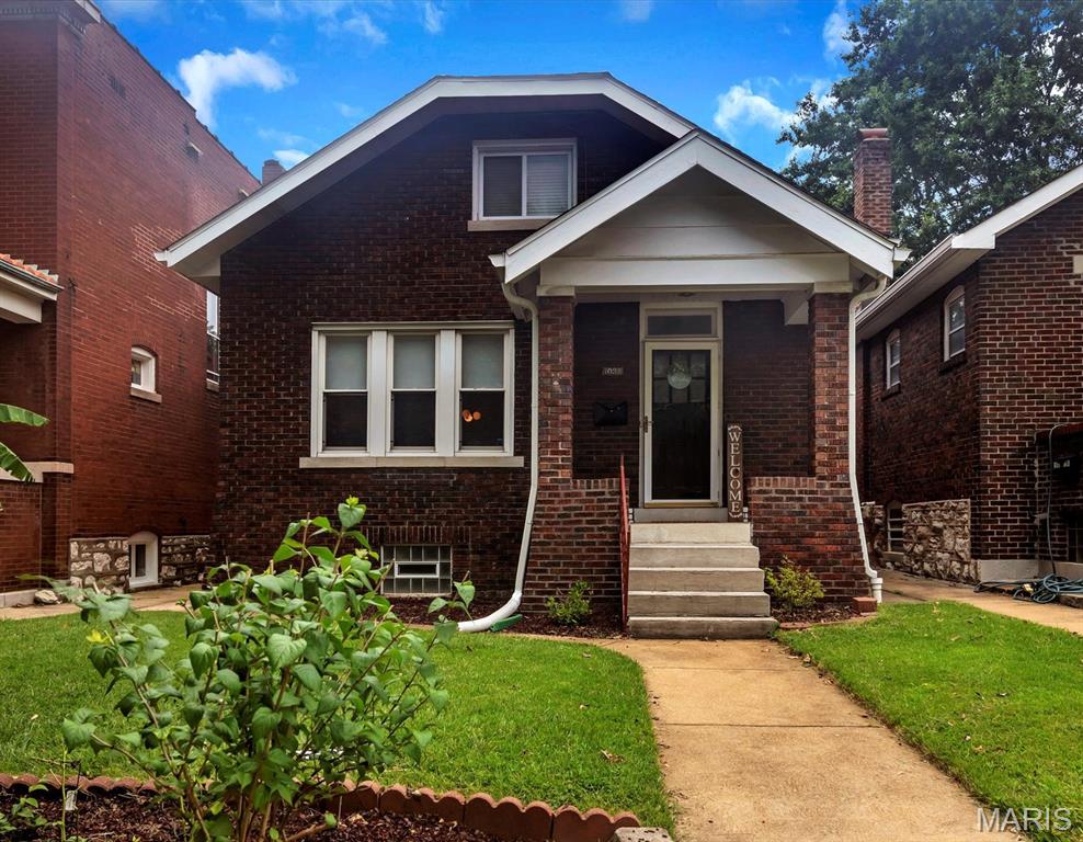 Welcome to this charming brick home, just steps from Forest Park and the heart of Dogtown! This move-in-ready 4 BDRM / 2 BATHS home offers the perfect blend of lifestyle and everyday functionality, with quick access to highways and all the shops, restaurants, and festivals the historical Dogtown community has to offer! 
The main level welcomes you with a warm, light-filled living space featuring hardwood floors, a decorative brick fireplace, a separate dining room perfect for gatherings, and a newer kitchen with walk-out access to a covered deck and a level, landscaped backyard—ideal for relaxing or entertaining. You’ll also find a stylishly updated bathroom with beautiful ceramic tile flooring, as well as a spacious primary bedroom with private access to the backyard oasis. Upstairs, two additional bedrooms with updated flooring and generous closet space offer flexibility for guests, office, or hobbies. BONUS: This home comes with newer AC, mini splits, furnace, and windows ( 2021), water heater, and architectural shingles roof (2019). The oversized unfinished basement provides excellent storage and endless potential. This is a rare gem meticulously cared home in a prime location—don’t miss your chance to live in one of St. Louis’s most vibrant and walkable neighborhoods. Schedule your visit today!