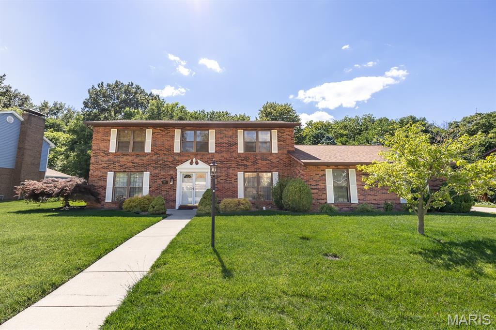 WELCOME HOME TO THIS ONE-OWNER TWO-STORY HOME SITUATED ON A PRIVATE, TREE-LINED LOT! This spacious home features 2 fireplaces, one in the great room and one upstairs in the primary bedroom. The main level has room for all your needs with a formal dining room, flex space and great room. The large laundry room offers abundant cabinetry and a utility sink for convenience. The kitchen is equipped with Corian countertops, double ovens, a cooktop and an updated refrigerator. Upstairs you will find 4 bedrooms (including the primary) and two full bathrooms. Additional highlights include a wet bar, beamed ceiling, vaulted patio with shades, some newer windows, updated siding and roof and sprinkler system. This well-maintained home is conveniently located close to schools, park, downtown restaurants and Scott AFB. Must see!