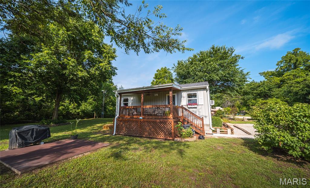 Escape to your own private riverside retreat! Nestled just down the road from the popular Boiling Springs Campground, this charming 1-bedroom, 1-bathroom cabin offers the perfect combination of relaxation, recreation, and investment potential. Whether you're looking for a weekend getaway, full-time escape, or an income-producing Airbnb, this unique property is ready to impress. Enjoy private river frontage with your own access point featuring a beautiful beach area, perfect for swimming, fishing, kayaking, or simply soaking up the peaceful surroundings. The cabin's warm and inviting interior showcases gorgeous wood finishes throughout, creating a cozy rustic atmosphere that perfectly complements the natural setting. The open-concept layout combines the kitchen, living room, and bedroom into one spacious and functional living area, making the most of every square foot while maintaining a comfortable and welcoming feel. Step outside onto the covered deck and enjoy your morning coffee while listening to the sounds of nature and the nearby river. Additional features include a large attached garage with plenty of room for a vehicle, boat, kayaks, ATVs, or extra storage. The security system, cameras, and TV are all included, providing added convenience and peace of mind. Surrounded by natural beauty and located near one of the area's favorite camping and floating destinations, this property offers endless opportunities for outdoor adventure. Don't miss your chance to own this rare riverfront getaway where privacy, recreation, and charm come together in one incredible package! Sale includes two parcels 08-9.0-29-000-000-007.006 & 08-8.0-28-000-000-021.005 totaling 5 acres.