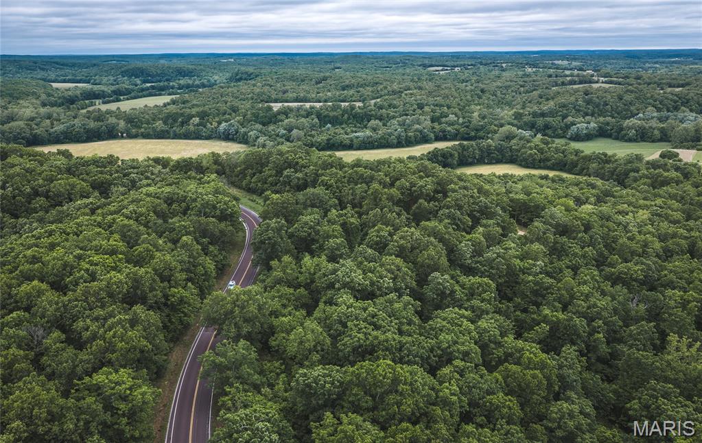 21 m/l acres in Pulaski County, Missouri with rolling terrain and solid timber throughout. This tract is mostly wooded with some marketable timber, offering both privacy and long-term value. A cleared building site sits just off Highway 7, positioned to take full advantage of what could easily be a million-dollar view—an ideal setup for your dream home or weekend place.

The hunting here is proven. This area is well-known for strong deer and turkey populations, and this property has produced multiple quality deer over the years. Whether you’re looking to hunt or just enjoy the outdoors, it checks the box.

Rural water and electric are available along Highway 7, making the property ready for development without the headache. While it does not have direct river frontage, it includes deeded access to the river through a common access point off Rock Bluff Drive—giving you the benefit of the water without the added cost.

Hard to find a tract this size with a build site, utilities, hunting, and river access all in one.