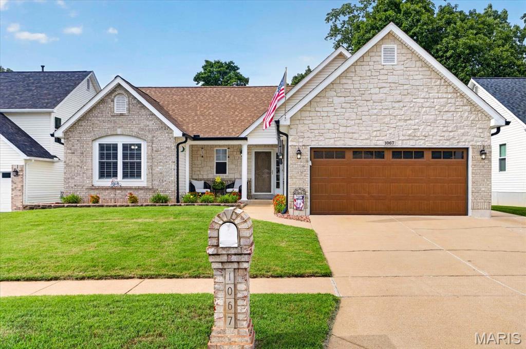 Welcome home to 1067 Autumn Oaks, a beautifully maintained 4-bedroom, 3-full-bath ranch-style home. Walking up to the home, you will notice the extensive brick and stone work, along with the extensive landscaping in the front and back yards. Entering the home, you will love the open spaces with a vaulted Great Room with gas fireplace, which flows into the dining room with bay window, and breakfast room.  The updated kitchen features 42 inch cabinetry, quartz countertops, stainless steel appliances, and custom backsplash.  The spacious primary suite features en-suite bath and walk-in closet. Also on the main level are two bedrooms, an additional full bathroom, and main-floor laundry. The lower level adds even more flexibility, featuring a fourth bedroom, full bathroom, comfortable living space, bonus room currently enjoyed as a game room, and a walkout to the back yard. Outside, you will enjoy the composite deck overlooking the beautifully landscaped yard. The garage is another standout feature, complete with epoxy flooring, a full screen door that easily slides down and setup for entertaining and lounging if desired. With great landscaping, generous living spaces, a flexible lower level, an impressive garage, and a backyard made for enjoying, this home is truly a MUST SEE.