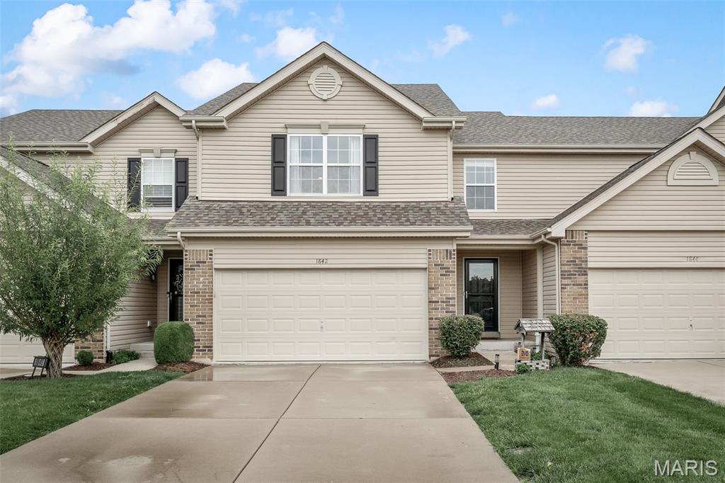 Come see this beautifully updated home in the desirable Ohmes Farms community!
This stunning 3-bedroom, 3.5-bathroom townhome offers the perfect combination of style, comfort, and low-maintenance living in one of St. Charles County’s most sought-after locations.
From the moment you arrive, you’ll appreciate the attractive brick front elevation, covered front porch, professional landscaping, and exceptional curb appeal. Out back, a spacious composite deck provides the perfect setting for relaxing, entertaining, or enjoying your private outdoor space.
Inside, you’ll find a thoughtfully designed floor plan featuring beautiful, engineered hardwood flooring and an inviting living room highlighted by a striking electric fireplace. The well-appointed kitchen offers both style and functionality, making it ideal for everyday living and hosting family and friends.
Upstairs, the spacious primary suite serves as a private retreat, complete with a beautifully updated bathroom and two walk-in closets. Two additional generously sized bedrooms and a full bathroom provide plenty of space for family members, guests, or a home office.
The finished basement boasts a living quarter that can be used for entertainment or an additional bedroom with a private bathroom.
Residents of Ohmes Farms enjoy a beautifully maintained community that offers the perfect blend of convenience and carefree living. The home is surrounded by parks, walking trails, and outdoor recreation opportunities, including nearby Barat Haven Park, featuring a scenic lake, sports fields, miles of walking trails, and expansive green space. The nearby Dardenne Greenway and Bluebird Meadow Park provide endless opportunities for walking, running, biking, and enjoying the outdoors.
Whether you’re searching for a peaceful place to call home or want convenient access to shopping, dining, entertainment, and major highways, 1842 Sterling Oaks Drive places you just minutes from St. Peters, O’Fallon, and Dardenne Prairie. This exceptional townhome delivers outstanding value, modern amenities, and an unbeatable location. Don’t miss your opportunity to make it yours!