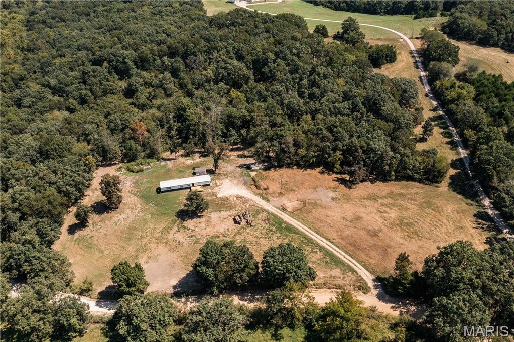 Welcome home to peaceful country living! This fully remodeled 3-bedroom, 2-bath manufactured home sits on 14.5 (+/-) beautiful, unrestricted acres. Enjoy privacy, and room to grow. Easy country access with the convenience of nearby town. This home has so much to offer. Schedule your showing today!