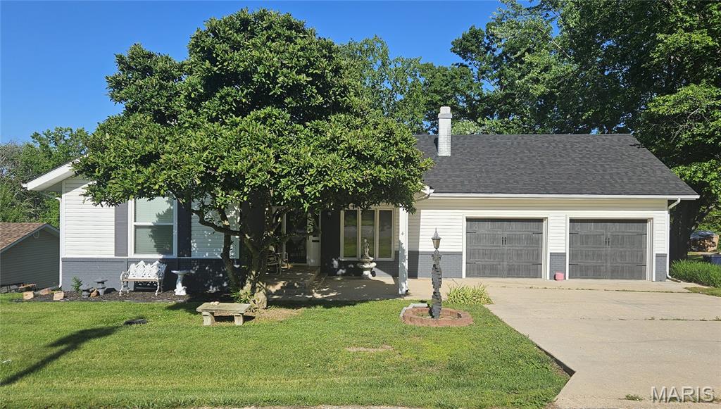 Whether your style leans modern or traditional, this beautifully updated, eclectic home delivers the best of both worlds—with space to spare!  From your covered front porch step into a light-filled formal living room featuring soaring ceilings, a cozy wood-burning fireplace, and updated flooring that carries throughout the home. Just beyond, you’ll find a spacious formal dining area that flows seamlessly into the kitchen, complete with butcher block countertops, updated sink, dishwasher, disposal, stove, and refrigerator—perfect for everyday living and entertaining alike. A stunning sunroom addition, equipped with a brand-new mini-split (2026), offers year-round comfort and opens to not one, but two private decks—ideal for morning coffee or evening relaxation.  The primary suite is a true retreat, featuring private deck access and a beautifully remodeled ¾ bath. Two additional bedrooms and a second full bath—complete with updated fixtures, flooring, and a luxurious soaking tub—provide plenty of room for family or guests. Convenient main-floor laundry adds to the home’s functionality. The full walk-out basement expands your living space even further, boasting a massive family/rec room and a third bathroom—perfect for entertaining, hobbies, or multi-generational living.  Additional highlights include: attached 2-car garage with updated doors and coded entry. Programmable front door lock.  Updated windows in bedrooms and kitchen. New roof (2025) HVAC replaced in 2020 Updated paint, flooring, and blinds throughout and exterior basement walls texturized and freshly painted. Out back, you’ll fall in love with the expansive yard—ideal for BBQs, play, gardening, or even adding a pool. Tucked along the edge of town, this move-in ready home offers the perfect blend of comfort, style, and space—inside and out. All that’s left to do is unpack and enjoy!
