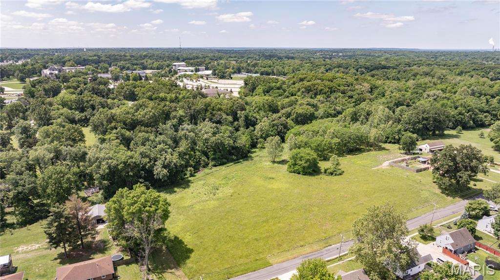 Right in the heart of Godfrey, setting adjacent to Lewis & Clark Community College, is this beautiful 25+/- Acres just waiting for a new owner. This property features a nice open area for the perfect build site and some gorgeous mature hardwood trees on the back of the property that provide for a little privacy. This property has a country feel and yet boasts all of the perks of nearby amenities. Don't let this opportunity pass by to own a large piece of property next to the community college!