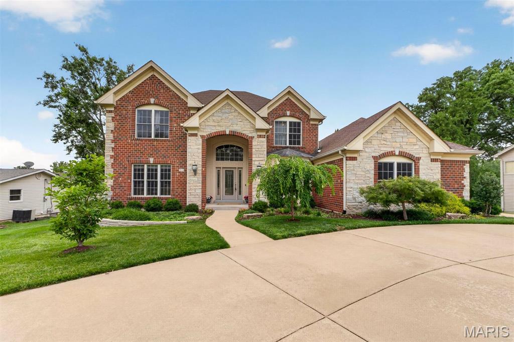 Exceptional value in the Ladue School District! This stunning newer 1.5-story home offers an impressive blend of elegance, comfort, and functionality, all situated on a beautiful .6-acre lot with plenty of room to enjoy outdoor living and entertaining. The spacious floor plan is highlighted by a large kitchen that serves as the heart of the home, featuring abundant cabinetry, generous workspace, and seamless flow into the large hearth room—perfect for everyday living and gathering. Two beautiful fireplaces add warmth and character to the main living areas. Rich moldings and quality architectural details throughout reflect the home's craftsmanship and timeless appeal. The luxurious main-level living spaces are complimented by three private bedroom suites on the second level, providing comfort and privacy for guests. With its generous room sizes, thoughtful design, and outstanding setting, this home offers the perfect balance of sophistication and livability. A rare opportunity to own a beautiful newer home in one of the area's most desirable locations.