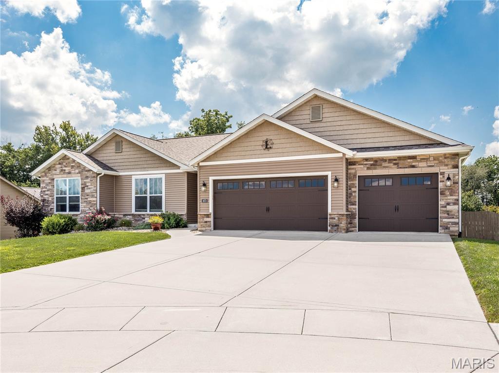 Close to the bike trail, located on a cul-de-sac, fenced yard with a nice shed! You will love the covered deck that also has an open deck with stairs leading to the lower-level covered patio. Walk into this beautiful home with an open floor plan, hardwood floors, corner fireplace in living room. Kitchen features granite counter tops, up-graded cabinets and large island. Walkout lower level has spacious family room, large bonus room with half bath. Workshop area off the family room and plenty of storage room in the other unfinished area. Oversized 3 car garage. Roof new April of this year. Refrigerator new Sept. 2025. Great home in a great location!!