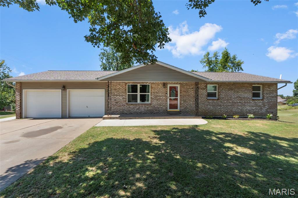 This charming, move-in-ready all-brick ranch offers 3 bedrooms, 2 full bathrooms, and sits on just over an acre of land. The home has been thoughtfully updated within the last 5 years, including updated flooring throughout, an updated kitchen and bathrooms, fresh paint, newer windows, and roof. The full, partially finished basement provides additional living and entertaining space with a family/rec room, laundry area, and enclosed mudroom. The mudroom leads directly to the rear patio, creating a great setup for outdoor entertaining and enjoying the spacious property. For the car enthusiast, hobbyist, or anyone needing extra workspace, the 36' x 36' shop is sure to impress. The shop includes a vehicle lift, making it ideal for working on automobiles, tackling projects, or storing equipment and toys. Conveniently located just a few miles from Interstate 55 and downtown Perryville, this property offers the perfect combination of peaceful acreage, functional space, and easy access to town and the interstate. If you're looking for a well-maintained home with plenty of updates, outdoor space, and an incredible shop, this one is definitely worth a look!