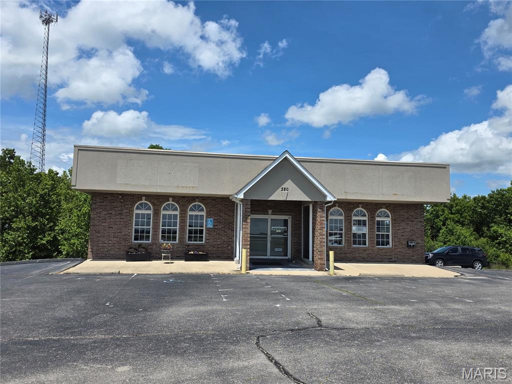 Great Investment Opportunity- Take a look at this Commercial Building with 2632 sq feet on main floor and another 2632 sq. feet of unfinished walk-out basement with Garage Door. One unit is rented for $1000 per month and is being used as a Medical Facility - the other unit has an active business with Penske Trucks. Each side pays their own utilities including each unit having their own alarm system. Location is ideal for visibility from I-44 ,large asphalt parking lot, and location close to shopping as well as main gate of Fort Leonard Wood. Schedule your private showing today!