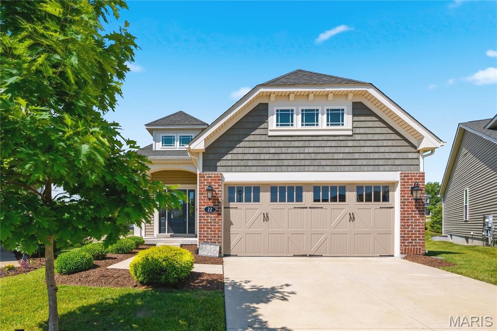 Impressive free-standing Villa in the sought after Oakleigh Park neighborhood! This 3 bedroom, 3 bath home offers 2,201 sq ft of open, well designed living space. Sitting on a cul de sac lot in this highly-desirable neighborhood, there is easy access to amazing parks, recreation areas and the Centennial Greenway for biking and walking. The exterior is elegant with brick, vinyl and shake siding, carriage style garage doors, coach lights, architectural shingles, prairie grills in the windows, professional landscaping, lawn irrigation, a patio and a deck overlooking the tree lined backyard. Features include 9 foot ceilings, luxury vinyl plank flooring and crown molding throughout the main living areas, an on-trend Kitchen with 42 inch cabinets, quartz countertops, designer tile backsplash, gas range, stainless steel appliances, seating bar, pantry, recessed lighting, main floor laundry, 50 gallon water heater and more.  There are transom windows in the Dining area and the Great Room has a large 3 panel sliding door that opens to the deck.  The Primary Bedroom Suite has a walk-in closet and Primary Bath with a double bowl vanity, dressing table and shower with bench seat. There is a spacious secondary bedroom and a guest bath on the main floor. The walk out lower level is finished with luxury vinyl plank flooring throughout, a large Rec/Family Room, Flex Room, Bedroom and a full bath. A monthly fee covers lawn care, landscaping, snow removal (per indentures) and more. Students will attend sought after Francis Howell Schools. There is easy access to Highways 364, 94 and 70, Lambert International, shopping, restaurants, parks, services, historic downtown St. Charles, the Streets of St. Charles Entertainment District and more.  Amazing opportunity, beautiful home, so much to love!