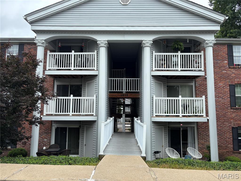 Upper level condo in Sherwood Place with vaulted ceilings that provide an open look and feel. LVP flooring in living room, kitchen and hallway.  Offers two large bedrooms and two full bathrooms as well as in-unit laundry with stackable washer and dryer that are part of the sale.  Balcony off the living room has a large storage closet as well as room for table and chairs to enjoy morning coffee. Unit has fresh paint throughout including the kitchen cabinets, new HVAC in 2025, and new water heater in 2024, roof replaced in 2026.  Unit comes with one assigned covered parking space. Priced to allow buyer to update carpet and fixtures to make it their own. Refrigerator is included in sale. Located close to Creve Coeur Lake, shopping, and major highways. Community pool located within walking distance .  HOA does not allow rental.