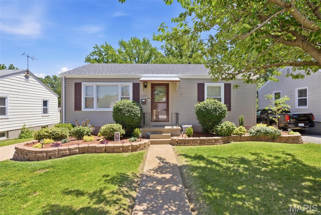 Welcome home to this charming and well-maintained St. Ann gem! Nestled on a quiet street, this home offers comfortable living with a functional layout and inviting spaces throughout. Step inside to find a bright living area filled with natural light, spacious bedrooms, and an updated kitchen ready for everyday living and entertaining. Enjoy the convenience of off-street parking, a generous backyard perfect for gatherings, pets, or gardening, and easy access to shopping, dining, parks, and major highways. This home is full of potential and move-in ready charm. Features include new roof, gutters and front gutter guards in 2026, composite rear deck, freshly painted interior walls, refinished hardwood flooring throughout and much more! Seller is leaving refrigerator, stove, microwave, washer/dryer, freezer and additional fridge in the basement. Don’t miss your chance to make this St. Ann beauty your own!