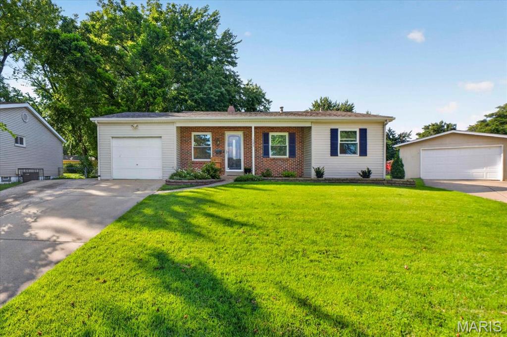 Move right into this beautifully updated ranch nestled on a quiet cul-de-sac in the heart of Florissant! This charming 3-bedroom, 1.5-bath home offers the perfect blend of modern updates, functional space, and everyday comfort. Step inside to find fresh paint throughout, creating a bright and inviting feel from the moment you enter. The spacious living room flows effortlessly into the updated kitchen, featuring crisp white cabinetry, granite countertops, stainless steel appliances, ample prep space, and a sunny breakfast area overlooking the backyard. The partially finished lower level provides a large rec room that's perfect for a second living area, home office, playroom, or workout space, while still offering plenty of unfinished storage for seasonal items, tools, and hobbies. You'll also appreciate the extended driveway and one-car garage, providing additional room for storage or a workshop. Outside, enjoy your own private retreat with a fully fenced backyard featuring a spacious patio that's ideal for entertaining, grilling, or relaxing. The expansive yard offers plenty of room for kids, pets, gardening, or future outdoor projects, all surrounded by mature trees that provide shade and privacy. Conveniently located near parks, schools, shopping, dining, and major highways, this move-in ready home is packed with value and ready for its next owner. Don't miss your opportunity to make this Florissant gem your own!