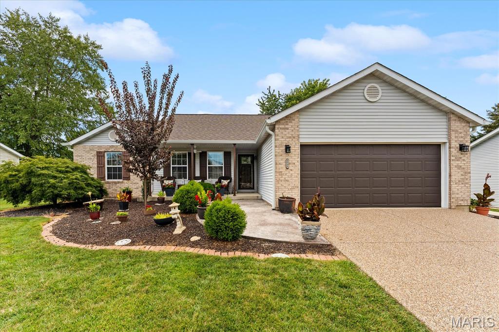 Immaculately cared for inside and out! This ranch home has an open floor plan with hardwood flooring throughout the majority of the main floor, a living room with sky lights and wood burning fireplace, dining area, and a luxury kitchen with quartz counter tops, custom island with gas range, custom stainless vent hood, and built in cabinet microwave and plenty of cabinet storage.   The convenient main floor laundry is off the kitchen and has plenty of extra storage and cabinetry. The updated full guest bath is shared with two main floor bedrooms both with hardwood floors. The primary bedroom also has hard wood flooring, a large walk in closet, access to the back deck, and an updated primary 3/4 bath with custom tiled shower, dual vanity, and built in vanity table with a transom window.  The finished basement has a large family room with electric built in fireplace, a wine cellar, a bonus room great for a craft room or office, another updated 3/4 bath, 4th bedroom, and yet another bonus room currently used as a storage area. And there is an additional unfinished storage room with built in shelves. Minutes to Scott Air Force Base, I64, Central Jr/O'Fallon High school, and shopping! Call for your appointment today! Audio and visual on the property.