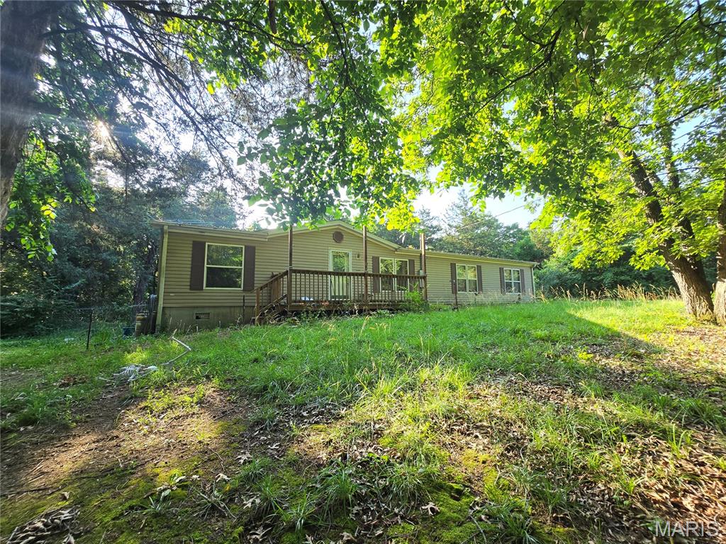 BUILD INSTANT EQUITY! Opportunity is knocking in Lake Timberline! Less than a mile from the lake, your spacious 1,800+ sq ft home is situated on approx .6 acres with a fenced in back yard, in a gated lake community and is ready for all of those Pinterest ideas you have been saving - giving you the opportunity to make this home your very own and presenting a rare chance to purchase well below the cost of many comparable homes in the area! This home offers tremendous potential for a buyer looking to add their own personal touches and build equity! Land, generous living space and a desirable community make Walnut Lane a rare find at this price point! The property is being sold as-is. Some personal items and debris may remain with the home after closing. Opportunities to purchase a home of this size and location at this price are increasingly rare - do not miss your chance to make it your very own! Bring your vision, customize to your taste and unlock the full potential of this amazing home before it's too late!