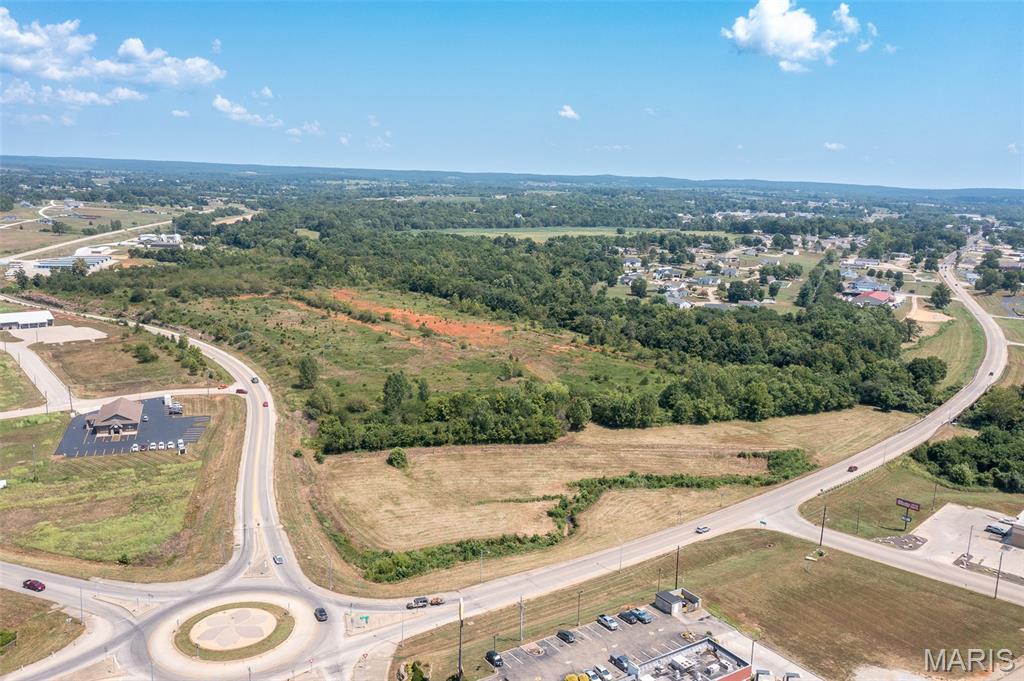-HIGH TRAFFIC LOCATION-   Take a look at this commercially zoned, 54.2 +/- acres in Fredericktown, MO! City water, sewer and electric are already located on the property, leaving one less step in the development process. Located near new and established businesses and housing, this property has over 1700' of Hwy 72 Bypass frontage, over 900' of frontage on West Main St., and approximately 4500' of St. Francis River frontage. This prime location is near Hwy 67 and provides opportunity for almost any type of business/commercial development but also has great potential for single or multifamily housing with a zoning change.