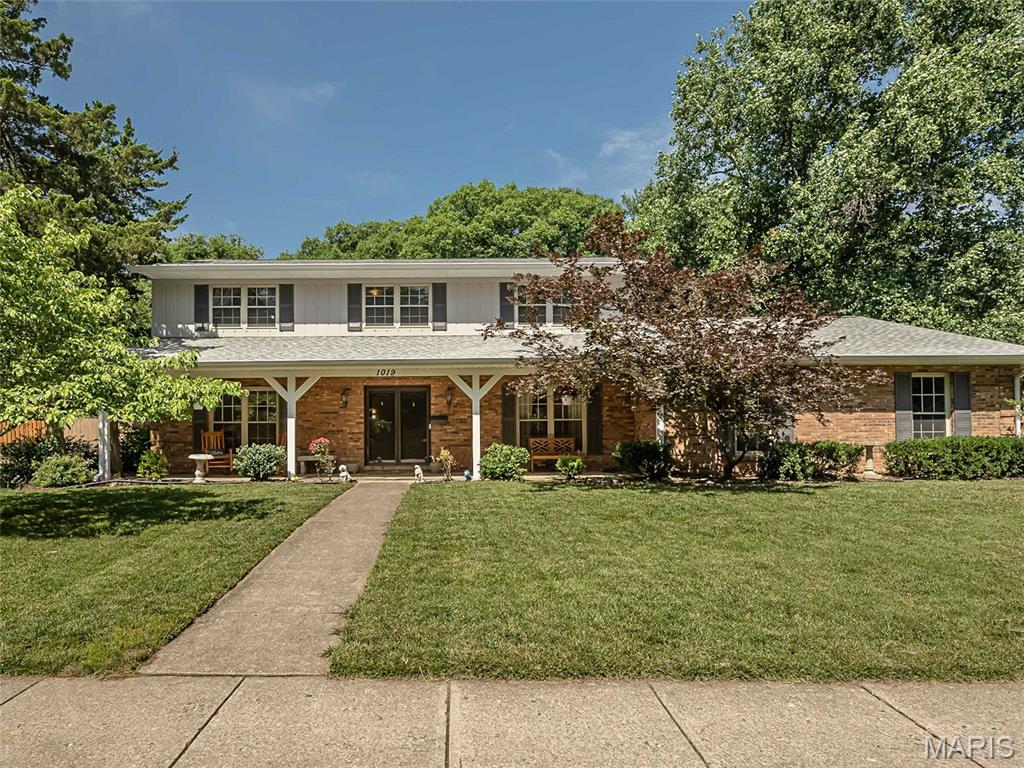 COMING SOON: Nestled on a park-like 0.75-acre wooded lot, this charming 4-bedroom, 2.5-bath traditional home in O'Fallon's Fairwood East subdivision offers the perfect private retreat. The character-filled interior boasts formal living spaces, a rustic great room with exposed beams and a brick fireplace, and a massive primary suite featuring its own fireplace. The true showstopper is the expansive screened-in back porch, ideal for peaceful mornings or entertaining while overlooking nature. Best of all, you are just minutes from top-rated schools, local dining, I-64, and an easy commute to Scott Air Force Base.