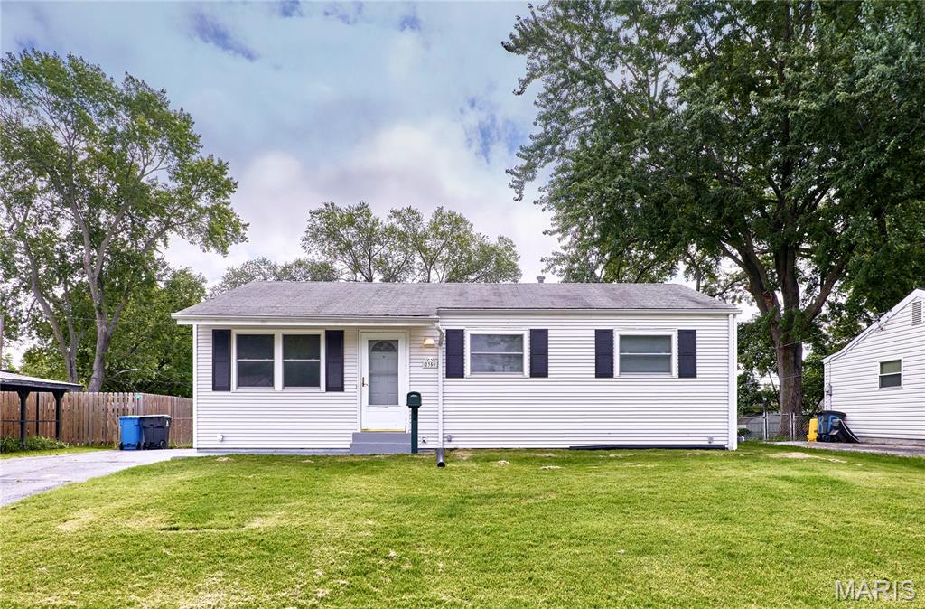 Welcome home to this adorable, move-in ready 3 bedroom ranch home with tons of great features to love! This home boasts a large kitchen, beautiful wood flooring, partially finished lower level, huge screened porch, level fenced yard, double wide driveway, and more! Step inside to the light & bright living room with wood flooring and large front window letting in lots of natural light. The spacious eat-in kitchen features an abundance of custom cabinetry, tons of countertop space, pantry, and convenient access to the huge screened porch! Through the sliding door is the additional patio and spacious, level, and fenced backyard with plenty of space for outdoor activities. The 3 light & bright bedrooms offer beautiful wood flooring and a full hall bathroom completes the main floor. You’ll love the additional living space in the partially finished lower level family room! Great location close to parks, shopping, and everyday conveniences within the Hazelwood School District. Don’t miss this charming ranch!