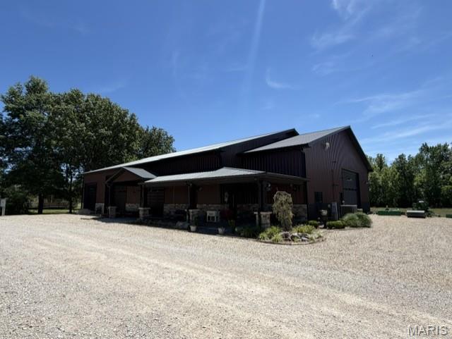 Welcome to a property where space, versatility, and an incredible water view come together! This impressive 5,600 sq ft +/- barndominium/shop house that offers endless possibilities. Inside, you'll find a complete 1-bedroom/1-bathroom living area full kitchen, making it perfect for a weekend retreat, guest quarters, or just comfortable living! With soaring 16-foot ceilings, an RV Bay with 16-foot door, additional garage bays with 14-foot doors, and an abundance of storage and parking space, there's room for all the boats, vehicles, equipment, and toys you could want. Additional lots are included with the property, creating even more opportunity- including space to build another home or property if desired. Making this property 2.18 +/- acres combined. Whether you're looking for the ultimate shop house, a recreational getaway, or a property if desired. Whether you're looking for the ultimate shop house, a recreational getaway, or a property you can continue to develop, the potential here is truly unlimited. Add in the beautiful water views, and this is one you'll want to see in person!