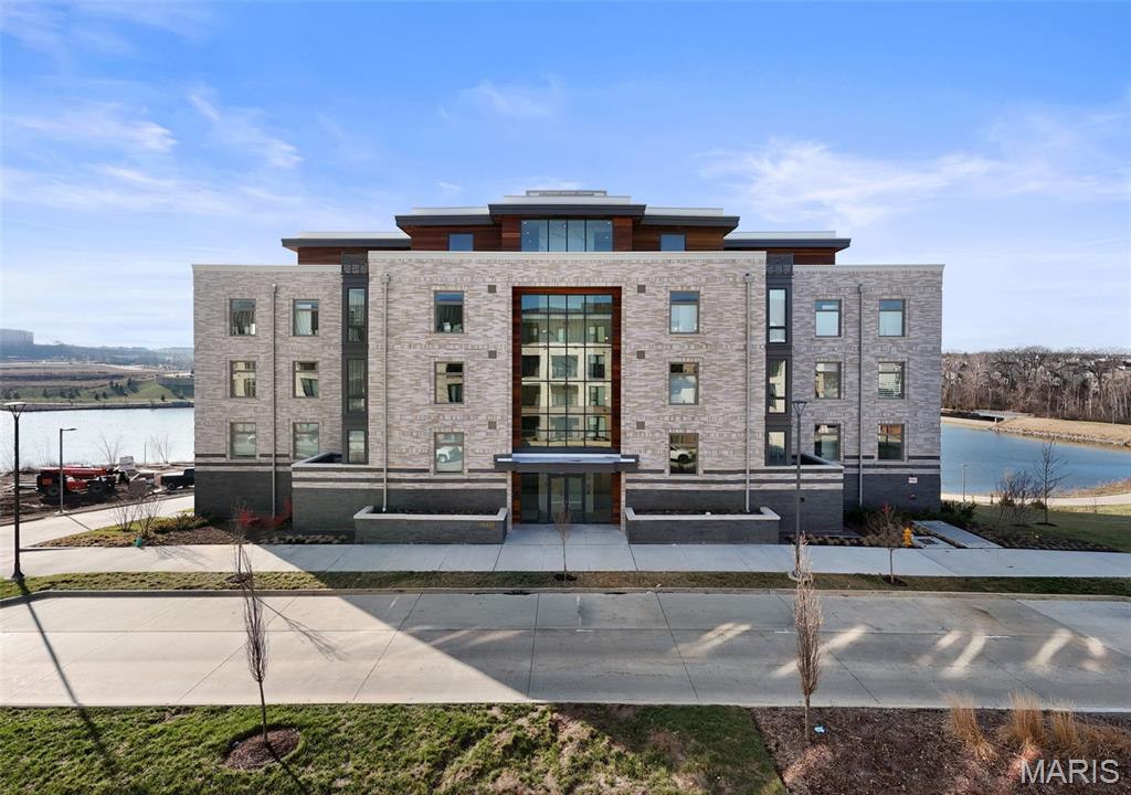 Designed, styled and curated.  This is a rare opportunity to own a brand-new, never- lived-in lakeside luxury condo in a newly constructed building-without the wait, construction disruption, or uncertainty of buying from the developer. While units are still underway for a second phase, this finished residence & building offers immediate occupancy, complete peace and quiet, corner exposure with insane unobstructed lake views & actual sightlines, a fully realized living experience from day one.  Thoughtfully designed with high-end finishes, refined details, and elevated craftsmanship throughout, this condo delivers the sophistication of new construction with the advantage of certainty – what you see is what you get. Enjoy quiet finished hallways, common area, established surroundings, and the ability to move-in now rather than waiting years for construction timelines. Ideal for buyers seeking luxury without compromise, this is a one-of-a-kind resale opportunity so why wait to build, live luxury now!