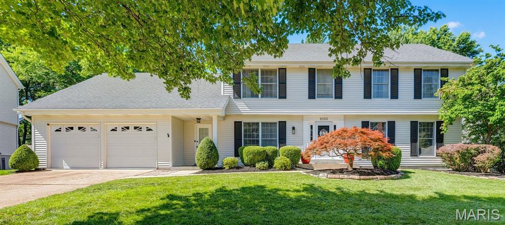 Welcome to an extraordinary opportunity in the highly sought-after Clarkson Estates, where timeless elegance, exceptional updates, and over 3,800 sqft of beautifully designed living space come together to create a truly remarkable home. Nestled on a quiet, tree-lined street and located within the acclaimed Rockwood R-VI School District, this meticulously maintained 5-bedroom, 4-bath residence offers the perfect balance of sophistication, comfort, and functionality. From the moment you enter the impressive foyer, you'll appreciate the home's open and inviting layout. Gleaming Brazilian hardwood flooring, elegant crown molding, designer lighting, and abundant natural light create a warm yet refined atmosphere throughout the main level. The foyer is flanked by spacious formal living and dining rooms, providing ideal spaces for entertaining or everyday enjoyment. The welcoming family room features custom built-in bookshelves surrounding a cozy fireplace, while the open staircase enhances the home's sense of space and architectural character. The heart of the home is the stunning chef's kitchen, thoughtfully redesigned and fully remodeled in 2026. Featuring quartz countertops, stainless steel appliances, a gas range, ceiling-height white shaker cabinetry, an exquisite ebony backsplash accented with gold trim, a charming butcher-block island, and a picture window overlooking the sink, this space is as beautiful as it is functional. The adjacent oversized mudroom and main-level laundry area provide exceptional convenience for today's busy lifestyle. Upstairs, you'll discover four generously sized bedrooms, including an impressive primary retreat featuring dual walk-in closets with custom organization systems. The luxurious ensuite bath offers a classic clawfoot soaking tub, separate shower, dual vanities, and the perfect setting to relax and unwind after a long day. New carpeting installed in 2024 adds comfort and style throughout the upper level. The finished walkout lower level expands the home's versatility with a massive recreation room ideal for movie nights, game days, entertaining, or creating the ultimate gathering space. A fifth bonus room offers endless possibilities as a guest suite, home office, hobby room, fitness area, or gaming room. A full bath and substantial unfinished storage area complete the lower level, providing room for a workshop, seasonal storage, and future customization. Step outside and discover a backyard designed for making memories. Beautiful landscaping showcases multiple flower beds, manicured shrubs, a stunning Japanese Maple, and mature trees that provide just the right amount of shade while still allowing sunlight to bathe the expansive yard. The level, park-like setting offers endless possibilities, whether you envision a luxurious inground pool, gazebo, play area, gardens, or simply open green space to enjoy. The oversized elevated multi-tiered deck serves as an extension of the home's living space and creates the perfect outdoor retreat. The list of recent improvements reflects the exceptional care invested in this home, including a complete kitchen remodel, updated lighting throughout, fresh interior paint, renovated bathrooms, newer HVAC system with whole-house humidifier and airflow enhancements, attic insulation improvements, updated landscaping, deck improvements and staining, closet organization systems, flooring updates, and numerous maintenance upgrades that provide peace of mind for years to come. Perfectly positioned near Chesterfield's premier shopping, dining, parks, golf courses, walking trails, lakes, hospitals, this exceptional residence is also within walking distance of Marquette High School and Kehrs Mill Elementary School. Meadowbrook Country Club is just moments away, further enhancing the lifestyle offered by this coveted location. Luxury, thoughtful design, outstanding maintenance, and an unbeatable Chesterfield setting combine to create a home that is truly special.