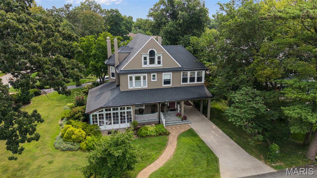 One of the most historic homes in Kirkwood has been meticulously restored to its remarkable 1885 glory and you could become the next purveyor of its history. 400 Miriam has only had 4 owners during its 141 years. It was built in the beloved Victorian style by known St. Louis architect, John Mitchell with his family. The current owners devoted many of their days to finding the original exterior colors of the estate and so much more, which included 2 separate buildings nearby; today, these are neighboring homes. You'll be floored by the lovely hardwood, custom millwork, stretching windows, and historic details throughout. 

The main floor showcases its stately staircase upon entry, a stunning marble fireplace mantel in your main lounge, a 3-seasons sunporch with ornate fireplace and stone flooring for all sorts of entertaining, a grand dining room, a butlers station, a restful den, and an eat-in kitchen with custom cabinetry and state of the art kitchen appliances. The second floor boasts 3 oversized bedrooms, one used currently as an office and two with ornate fireplaces, another large sunroom with full HVAC, a primary suite with walk-in closet and full bath that put others to shame, and another beautiful full bath and half bath round out the floor. The top level has two more bedrooms and a full bath with clawfoot tub. One of the rooms is quite large currently used as a home theatre!

Another full bathroom in the basement, and the clean, well-organized workshop showcases the care put into all parts of this property. Heading outside, you of course have your drive-in carport on the west side of the property, and to the east is the oversized 2-car garage with another work area with a setup for your electric vehicle. Outside, you'll also see the great attention given to landscaping bringing so much natural beauty to an already sterling exterior of the home.

With all the mechanical, tactical, historical, luxurious, and proper updates to this 141-year old property, it is sure to live on for another century with the love and care from the right owner.