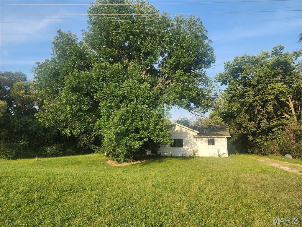 Bring your ideas and make this ranch home your own! Featuring convenient main-floor laundry and plenty of potential, this home is ready for its next owner to add their personal touches. The yard offers space for the garden enthusiast, room for the kids to play, or a place for your four-legged family members to enjoy. Just off the kitchen, you’ll find a nice-sized bonus sunroom—perfect for enjoying your morning coffee, relaxing in the evening, or creating additional gathering space. The basement provides extra storage, while the detached garage offers additional space for the hobbyist, tools, or projects. With a little imagination and renovation, this property could be transformed into the home you’ve been dreaming of. Property is being sold AS-IS. Seller will make no repairs and will not satisfy or provide for any occupancy requirements, if applicable. Buyer/Buyer’s Agent to verify all information. Sitting on just over .06 of an acre.