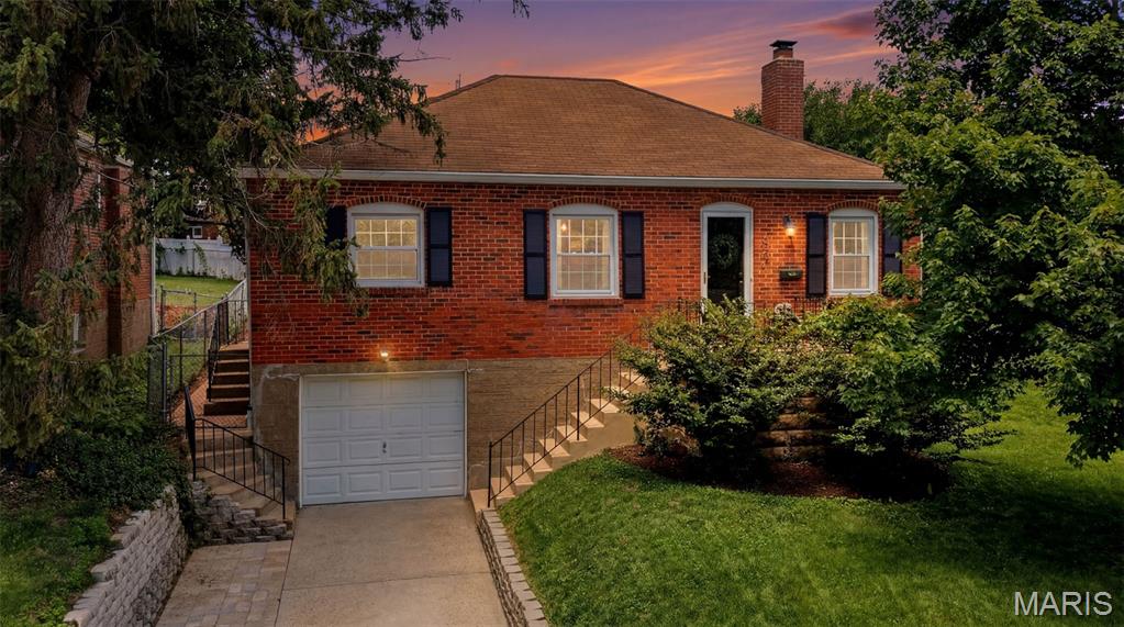 Welcome to this very cute, updated brick bungalow in highly desirable Rock Hill.  You will enjoy the hardwood floors in this 2 bed, 1 bath all brick home.  The Dining room and living room are wide open and connect to an updated kitchen with custom cabinets. Harwood floors throughout are in excellent condition. All appliances as well as washer/dryer are included in the sale. The walkout basement is large with a big rec room and lots of storage as well as a tuck under garage. There is a recent driveway extension for more parking space. You will love the large back yard and patio. The smoker, patio furniture/umbrella,and basement freezer are not included in the sale.