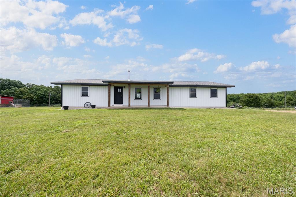 Turnkey Country Home on 27.36 Acres – Hunting, Homestead & Modern Comforts! Welcome to your dream property in Edgar Springs! This beautifully updated 3-bedroom, 2-bath home with a walkout basement sits on 27.36 acres m/l of mixed pasture and timber, offering the perfect blend of modern amenities, homestead potential, and outstanding hunting opportunities. Step inside to discover a completely renovated kitchen featuring granite countertops, all-new cabinetry, and a full suite of new appliances. Recent improvements throughout the home include updated electrical, approximately 70% new plumbing, all new doors, new flooring, and mini-split systems for efficient heating and cooling. The inviting living room is centered around a cozy wood stove, while the bedrooms provide comfort and charm with fresh carpet and real wood doors. The walkout basement includes a third bedroom and a full bathroom, with additional space ideal for a family room, recreation area, or guest quarters. Major exterior updates include a new roof (2023), durable steel siding, improved attic insulation, and a spacious 2-car garage. Outside, you'll find everything needed for country living. Enjoy breathtaking views from the newer concrete patio overlooking the large fenced yard. The property includes approximately 2.75 acres of fenced area, a 20x40 kennel run adjacent to the chicken coop, a powered outbuilding perfect for a workshop or hobby space, and full 50-amp RV hookups in the backyard for guests or extended stays. The acreage features a wet-weather creek, mature timber, abundant wildlife, and excellent hunting opportunities right out your back door. Whether you're looking for a hobby farm, hunting retreat, homestead, or peaceful country residence, this property checks all the boxes while remaining conveniently located just a short drive from Rolla.