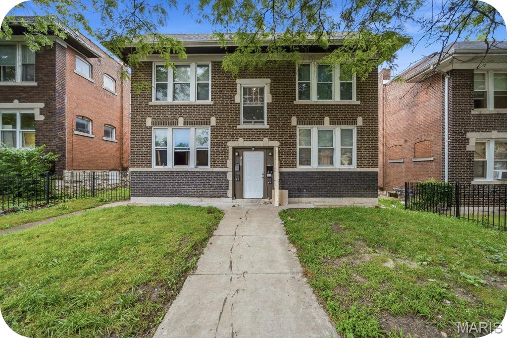 Income-generating, occupied 4-family! This updated brick building is the perfect opportunity to start or expand your investment portfolio. All four units have been improved with major big-ticket updates in 2018 including, but not limited: sewer lateral, 200 amp panels & electric, roof, windows, interior plumbing, updated baths/kitchens and HVAC. Each unit features a functional layout with a spacious living room, kitchen, large full bath, and 1 bedroom. Tenants enjoy off-street parking and a fenced yard, plus convenient access to public transportation. Current rents are $800 per unit with room to increase, providing solid income from day one. All tenants are currently month-to-month, but are willing to sign year leases, offering both flexibility and future stability. Don’t miss this turnkey investment opportunity!