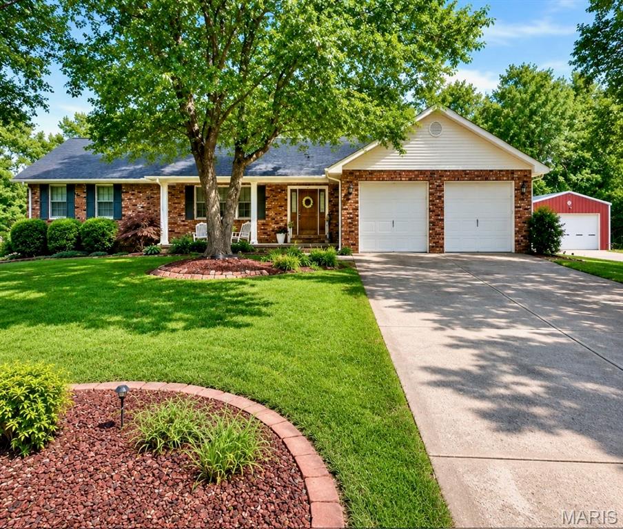 This exceptionally maintained brick home offers comfort, abundance of space, and impressive outdoor living all in one property. Situated on a beautiful lot with mature shade trees, professional landscaping, & walking trail access behind the home, this property has been thoughtfully designed inside & out.
The exterior features a covered front porch with white columns & shutters, attached two car garage, & private drive leading to the 40x24 detached shop complete with electric & RV hookups.
Inside the home offers a split bedroom design with 3 bedrooms & 2 bathrooms on the main level, including a large owner's suite with remodeled bath & custom tiled handicap accessible shower. Oversized living rm features a large picture window & recess lights, while the dining room offers built-in china cabinets and double doors leading the the sunroom that overlooks the pool area. The kitchen comes complete with stainless steel appliances, ceramic tile countertop & backsplash, snack bar, double door pantry & lazy susan. The finished walk out basement includes a huge family room, recreation room, mini kitchenette, bathroom,  storage closet and home component rm.
Outdoor amenities truly set this property apart with the fenced in swimming pool area, composite decking, covered patio, fenced courtyard, garden spot, sitting area, Japanese maples, and Ginko trees. Additional features include central heat & air, 2 LP ventless backup heaters.
*Remodel is being finished up.....Interior pics coming soon!