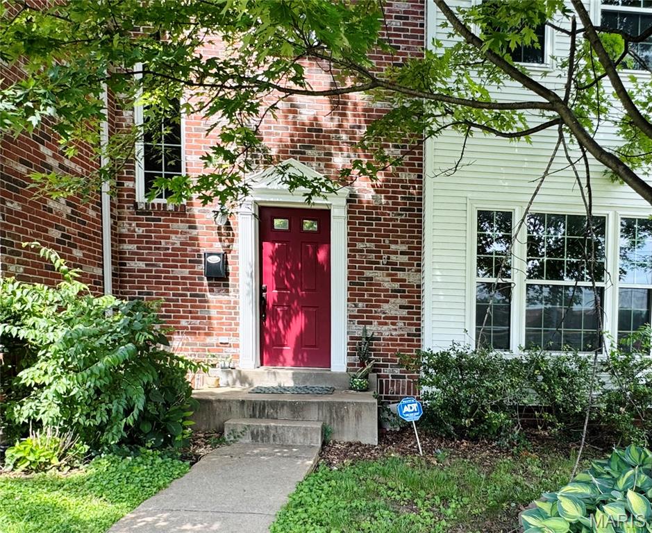 Welcome to easy living in the Village of University Place! Ideally located near Clayton, shopping, dining, and major commuter routes, this beautiful townhome offers convenience and style. Step inside to discover a bright, inviting interior featuring abundant natural light. Hardwood flooring enhances the main living spaces, while the thoughtfully designed floor plan includes a spacious living room with a cozy fireplace, an elegant dining room, and a well-appointed kitchen with ample storage. The adjoining breakfast room opens through sliding glass doors to a private deck, perfect for relaxing or entertaining. Upstairs, the spacious primary suite features a vaulted ceiling, an oversized walk-in closet, and a luxurious en-suite bath with dual vanities, a soaking tub, and a separate shower. A second bedroom with its own private bath and a conveniently located laundry area complete the upper level. The finished lower level provides additional living space, ideal for a home office, media room, fitness area, or extra sleeping area. An attached two-car garage adds everyday convenience. The property is currently tenant-occupied, making this an excellent opportunity for investors seeking immediate rental income.