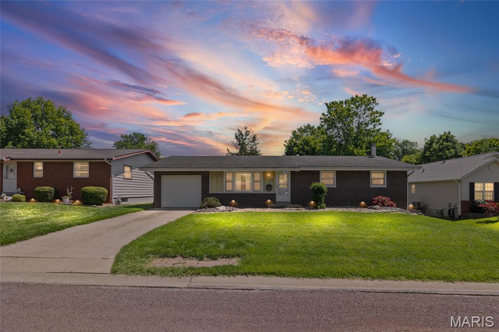 Welcome home to 1239 Lynn St.  This all-brick home has been lovingly and meticulously maintained by its original owners for almost 60 years and is now ready for its new owners and new memories.  As you approach the front door you'll notice the tasteful front yard landscaping and large picture window in the living room.  Upon entering the home, you'll appreciate the nicely sized living room adorned with an antique fireplace surround (non-functioning).  The kitchen/dining area is just steps away and offers an abundance of oak cabinetry and breakfast bar, storage is not an issue in this kitchen. Down the hall are 3 nicely sized bedrooms and full bath with a step-in shower and laundry chute. The lower-level family room offers additional living space complete with storage cabinets/shelving, built in bar (with refrigerator) and a gas fireplace for those chilly nights.  In addition, there is an office/flex room/4th bedroom (w/egress window), full bath, storage area, workshop area and laundry area. What you may not notice are the brand-new Anderson windows throughout the home.  The oversized garage offers storage space and access to the fenced in backyard and storage shed. Cracked ceramic tile in the basement bathroom is being replaced and the toilet will be re-installed before closing. Sump pump installed in May 2026.  Agent related to seller. Buyer and buyer's agent to verify all MLS information.