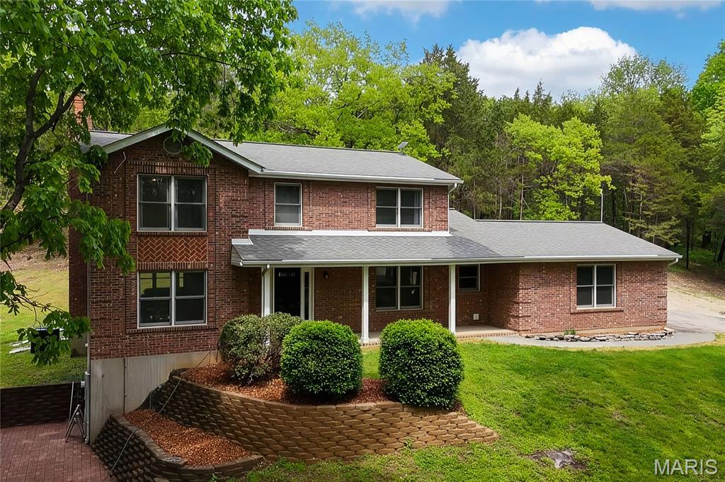 Stunning 2-story home renovated in 2022 and sitting on 5.45 acres located in the sought after Hunters Farm subdivision in Pacific! This home boasts over 3,000 square feet of living space including the finished lower level. 

The front door opens to the 2-story entry foyer with a coat closet, and opens to the formal dining room with an accent wall and the office/family room. The great room features a stone wood burning fireplace, bay window, and opens to the kitchen.

The kitchen boasts 42 inch cabinetry, quartz countertops, stainless steel appliances, tile backsplash, island with a butcher block countertop, dining area, and a new coffee bar with a wine fridge (2023). The stylish powder room completes the main level. 

The second floor features the primary bedroom with dual closets, with bi-fold barn doors and one has custom shelving, accent wall, and a luxurious bathroom. The primary bathroom boasts a dual vanity, soaking tub, and a separate shower with a new tile surround (2023). A full hall bathroom and two additional bedrooms complete the second level. 

The finished lower level features a recreation room which could be converted to a 4th bedroom, full bathroom, and ample storage space. Other highlights include: new shed (2026), 2 car garage, and painted neutral colors throughout. 

Relax outside on the side paver patio or the covered front porch and enjoy the private 5.45 acre lot! There is a cleared area in the back for someone to potentially add an outbuilding or detached garage. 

Location could not be better – close to major highways, restaurants, shops, and schools!