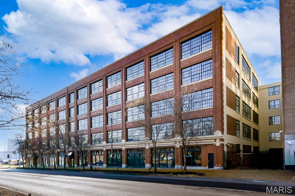 Experience the best of vibrant city living at West End Lofts—where convenience meets contemporary style. Perfectly situated in a prime central location, you’re just moments from top restaurants, shopping, medical campuses, hospitals, MetroLink access, and more—making everyday life effortlessly connected. Unit #417 offers a stylish, open-concept layout designed for modern living, featuring soaring ceilings, oversized windows that flood the space with natural light, and a screened-in patio—ideal for relaxing or entertaining. The spacious primary suite includes a large walk-in closet and a private bath with a double vanity and sleek step-in shower. An additional flexible room provides the perfect space for a home office, nursery, or guest area. New refrigerator AND new washer and dryer included in the sale! Residents enjoy a full suite of amenities, including a pool, fitness center, extra storage, and covered parking—everything you need for comfort, convenience, and an elevated urban lifestyle.
