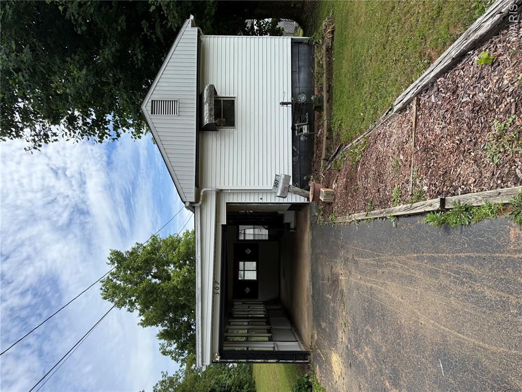 home offering several updates on a large-level lot. This property features two outbuildings, an attached garage and asphalt driveway. inside you'll find new luxury vinyl flooring throughout, kitchen appliances, washer & dryer and central heating and cooling. Move-in ready and affordable! schedule your showing today.