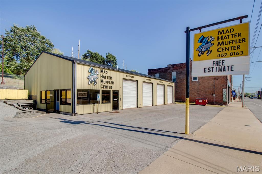Don’t miss out on this exceptional turn-key commercial opportunity to own a fully equipped, move-in-ready automotive shop in a high-traffic location! Conveniently situated just seconds from the Clark Bridge in Alton—across from McDonald’s and near major roadways—this well-established property offers excellent visibility, easy access, and steady traffic flow. Built for performance and efficiency, the building features durable metal siding and a spacious two-tier gravel and asphalt parking lot, perfect for customer convenience and vehicle storage.

The expansive shop area is designed for productivity, offering four well-maintained bays with four large overhead doors (10 feet wide by 12 feet tall) and approximately 14-foot ceilings. The shop includes four vehicle lifts—all in good working condition—including two 4-post heavy-duty lifts (25,000 lbs. and 12,000 lbs.), one 2-post brake rack (9,000 lbs.), and one 4-post rack (12,000 lbs.). Dual overhead gas furnaces heat the shop efficiently, though only one is typically needed, and a heavy-duty air compressor with two air lines services both sides of the workspace for maximum efficiency.

Inside, the property features a comfortable office and reception area with central air conditioning and a dedicated furnace, a break room/security room, and two half bathrooms—one of which is handicap accessible. The office also includes an upstairs loft area that provides additional storage space, as well as a separate furnace located in the loft. A new electric water heater adds to the property’s efficiency and convenience.

The sale includes a wide range of equipment, making this truly a turn-key operation. Included are a John Deere lawn tractor, a 1-ton hoist, Craftsman 5 HP 60-gallon air compressor, oil recovery unit, parts washer, Ben Pierson pipe bender, tire spin jack, Miller MIG welder (115V), file bench, screw jacks, creeper stools, neon “Open” sign, microwave, small refrigerator, TV monitor, coffee maker, and a full security camera and VCR system. A detailed equipment list is available upon request.

Both the upper and lower parking lots are included in the sale, offering plenty of space for vehicles and operations. The property is well lit, recently passed a city fire inspection, and all fire extinguishers are up to date. This location is well established for any automotive business and provides the ideal setup for an owner-operator or expansion of an existing enterprise.

Please note: The business name and phone number associated with the former business are not included in the sale.

Call today to schedule your private showing and explore the possibilities for yourself—this is a rare chance to acquire a fully functional automotive shop in a prime, high-traffic location.