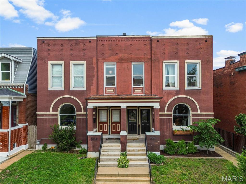 Welcome to 2907 Michigan Ave — a meticulously maintained showstopper in the heart of thriving Tower Grove East. This beautifully renovated 3-bedroom, 2.5-bath home perfectly blends historic charm with stylish modern updates, offering the feel of an Anthropologie-inspired retreat. Inside, you’ll find gorgeous wood floors, exposed brick walls, soaring 10-foot ceilings, and transom windows that fill the home with natural light. Thoughtful updates make the home completely move-in ready while still preserving its timeless character. The spacious primary suite features a private covered balcony overlooking the fenced backyard — the perfect place for morning coffee or unwinding at the end of the day. Out back, enjoy an updated patio and yard ideal for entertaining, gardening, or relaxing outdoors. A rare find for the neighborhood, the oversized 2-car garage adds both convenience and additional privacy to the backyard space.  All this just a short walk from Tower Grove Park, local restaurants, coffee shops, and some of St. Louis’s favorite neighborhood spots. This is a rare opportunity to own a truly special home in one of the city’s most vibrant communities.