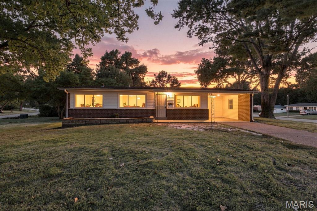 Welcome to this charming 4-bedroom, 2-full-bath home in the desirable Paddock Hills neighborhood! Offering approximately 1,420 SF of living space, this home features a mix of hardwood and laminate flooring, a full unfinished basement, and a spacious lot with mature trees. Recent updates include a roof replaced in 2022 and HVAC replaced in 2020. Enjoy relaxing on the covered front porch, large shaded corner lot and entertaining in the backyard under the 15 ft  x 9 ft covered pavilion with firepit area—perfect for large gatherings with family and friends. A small carport provides convenient covered parking. Great opportunity to add your personal touches and make this home your own!