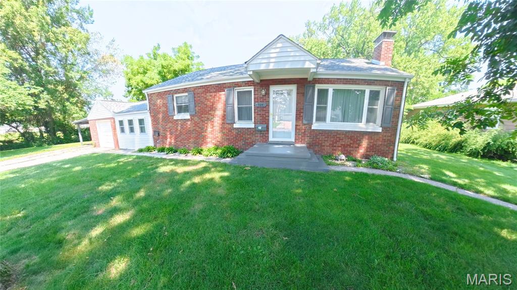Tucked away at the end of the street, this full-brick home offers exceptional privacy on a double lot surrounded by mature trees that provide abundant shade throughout the front and backyard. Inside, this three-bedroom home welcomes you with a spacious living and dining area featuring charming built-ins and a decorative, non-functioning fireplace. The adjoining kitchen includes all appliances for added convenience.

Just a few steps down, the former breezeway has been thoughtfully finished into an additional family room, creating flexible living space between the house and garage. This room features its own standalone heating and cooling system for year-round comfort and energy efficiency. The main-level bathroom, adjacent to the bedrooms, was recently remodeled with a fresh, light, and bright design. 

The full basement offers excellent potential for future expansion and includes a B-Dry waterproofing system with warranty. The basement also houses the laundry area and provides plenty of room for storage, hobbies, or additional finished living space. Additional peace of mind comes from the roof, which was replaced within the last year and includes a warranty.

Outside, enjoy the expansive yard from the huge concrete patio—an ideal setting for entertaining, relaxing, or taking in the peaceful surroundings. A one-car attached garage and attached carport provide additional covered parking. With its private setting, double lot, flexible living areas, recent improvements, and room to grow, this unique property at 504 W 4th Street offers space and possibilities inside and out.