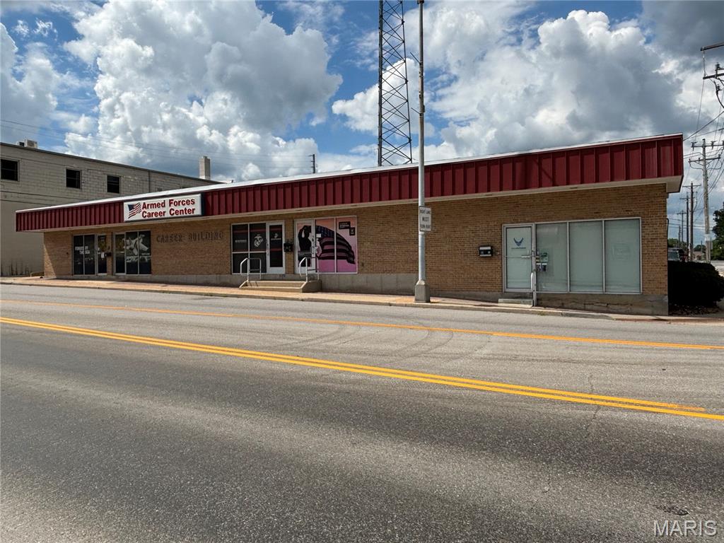 COMMERCIAL INVESTMENT PROPERTY in high traffic, downtown location with long term lease history by the US Government as the Armed Forces Career Center (Recruiting Station) including private parking with 13 spaces, four office suites, a common back hallway with secure access door, three restrooms, a janitor's work room including sink, and storage. In the past 7 years there have been HVAC upgrades, new carpet and paint in offices, new exterior doors, new stools, sinks, vinyl, ceramic tile, and paint in the common area bathrooms, new ceiling tiles, lighting, etc.  Gross yearly income to the owner is $33,200 and there are 4 years left of a 5 year lease.  Owner is responsible for taxes, insurance and equipment maintenance. Tenant pays all utilities and reimburses for the upgrades they request.