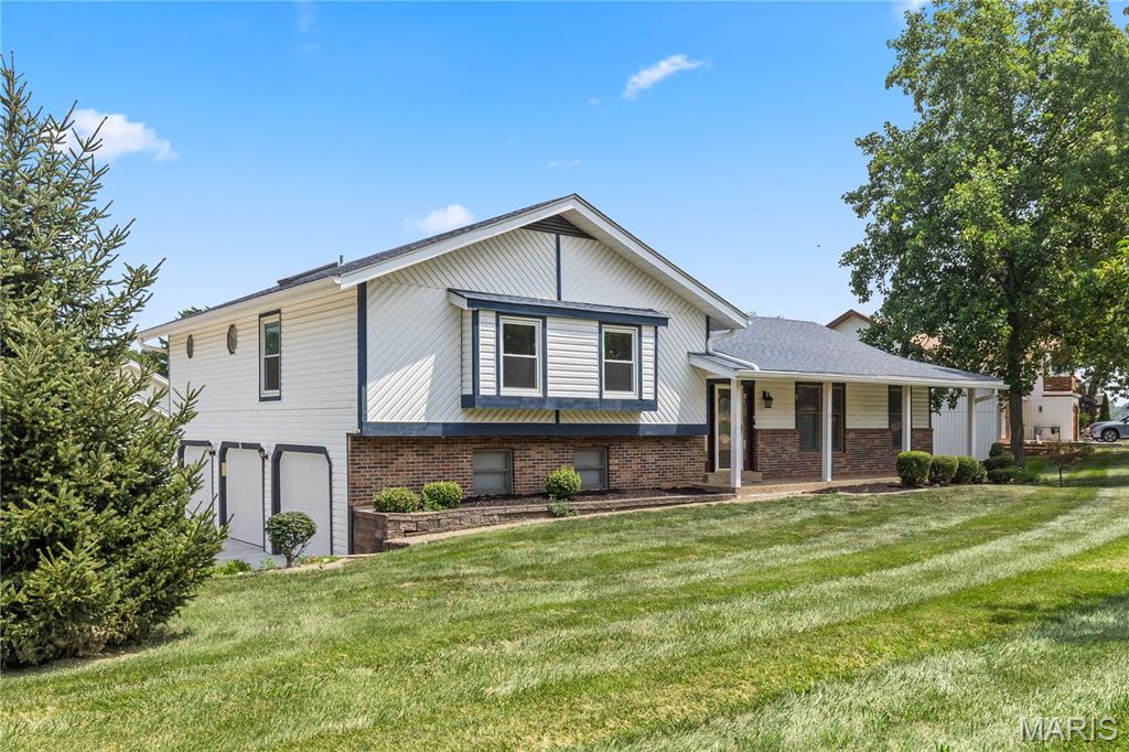 Showings start with the OPEN HOUSE Thursday 7/23 from 5-7!
Don’t miss your chance to tour this gorgeous three-bedroom, two-bath Lake St. Louis home nestled on a spacious half-acre corner lot. Offering exceptional curb appeal, this beautiful property features a side-entry oversized three-car garage, a large rear deck perfect for weekend gatherings, and plenty of yard space to enjoy outdoor living. The interior is bright and inviting with an open floor plan designed for comfortable everyday living and entertaining. The main level features a spacious dining area and an impressive living room highlighted by a striking brick fireplace, bright skylights, and abundant natural light. The eat-in kitchen is sure to please with stainless steel appliances, a large serving peninsula, generous counter space, and an adjoining breakfast room. Just beyond, the expansive three-season room offers the perfect place to relax while enjoying views of the backyard throughout much of the year. Upstairs, you’ll find two nicely sized guest bedrooms and a spacious primary suite featuring two walk-in closets and a private en suite with dual vanity, an oval soaking tub, and a walk-in shower. The finished lower level provides even more versatile living space with a large recreation room, private office with French doors, and abundant storage. As an added bonus, you’ll love being just minutes from the lake, making it easy to enjoy boating, fishing, and all the recreational amenities the community has to offer.